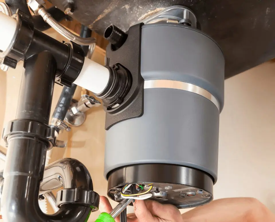 A person is working on the inside of a telescope.