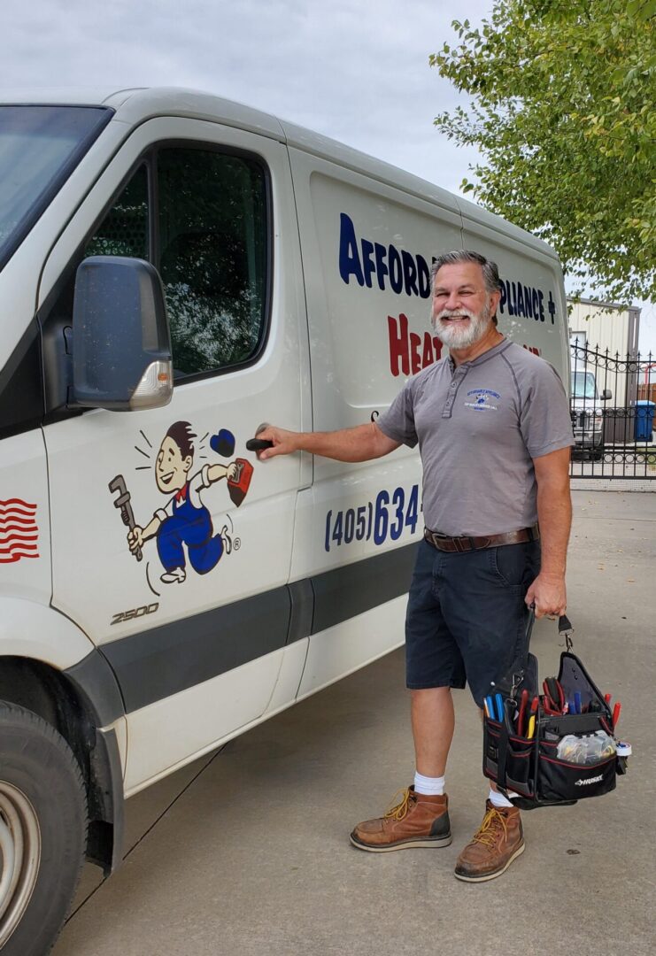 A man standing next to an old van